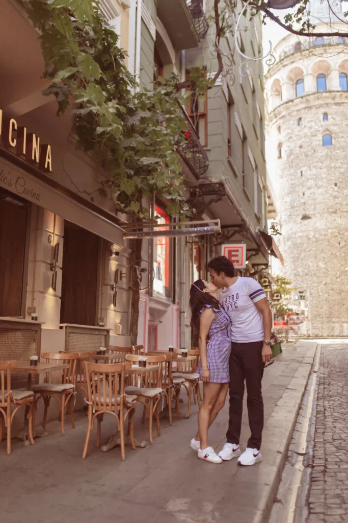 Couple sharing a quiet moment outside a cafe on a Galata street
