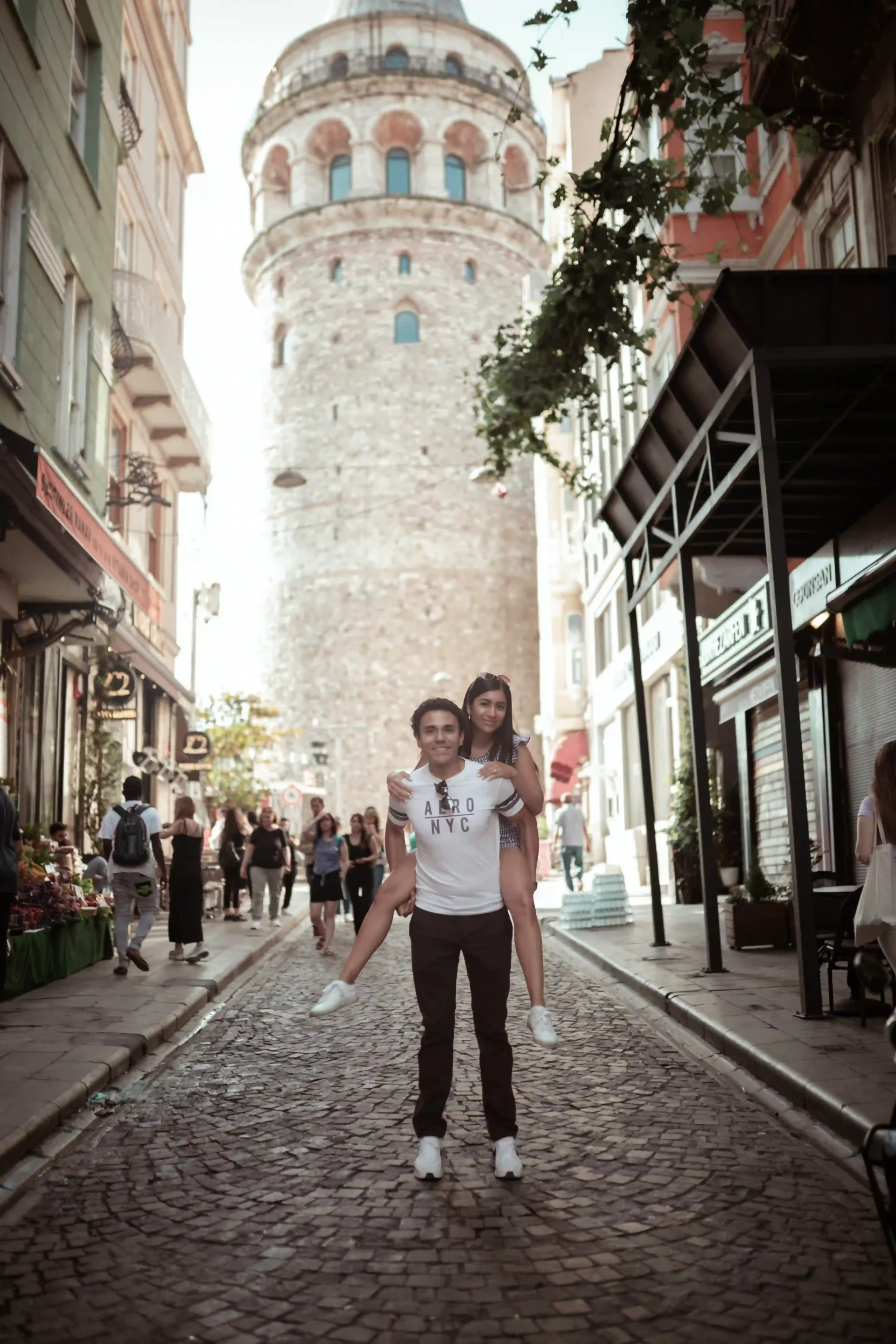 Quick street near Galata tower with cafes and early morning light