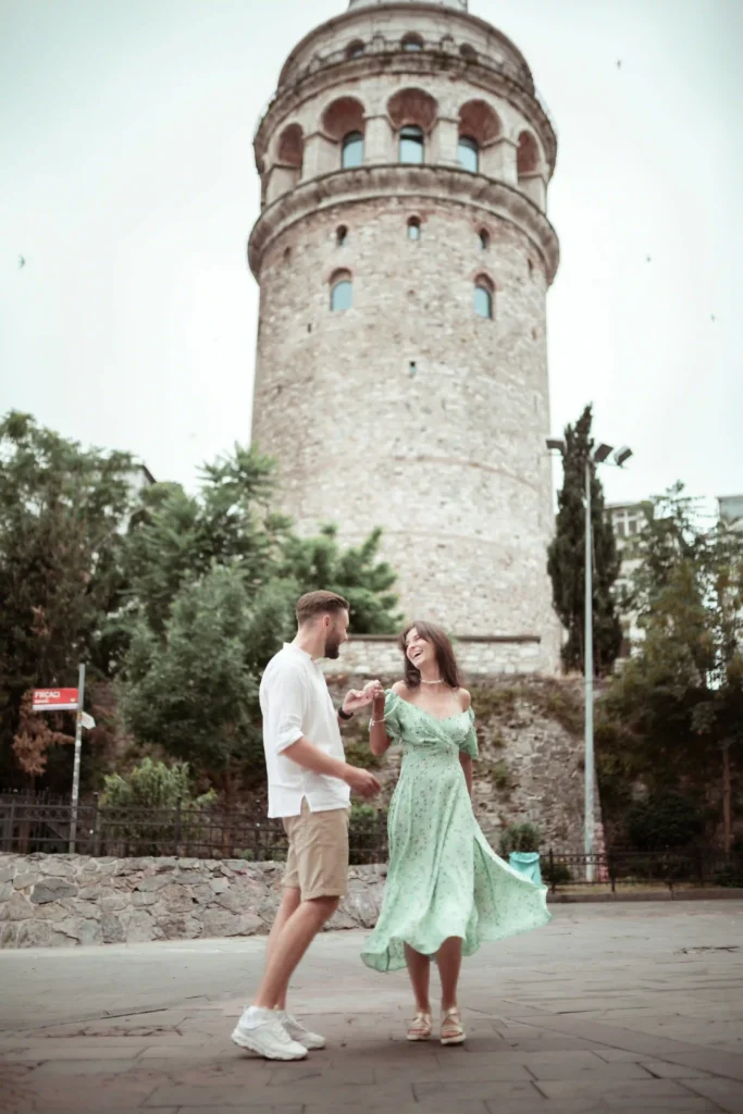 Couple dancing in an open space near Galata tower