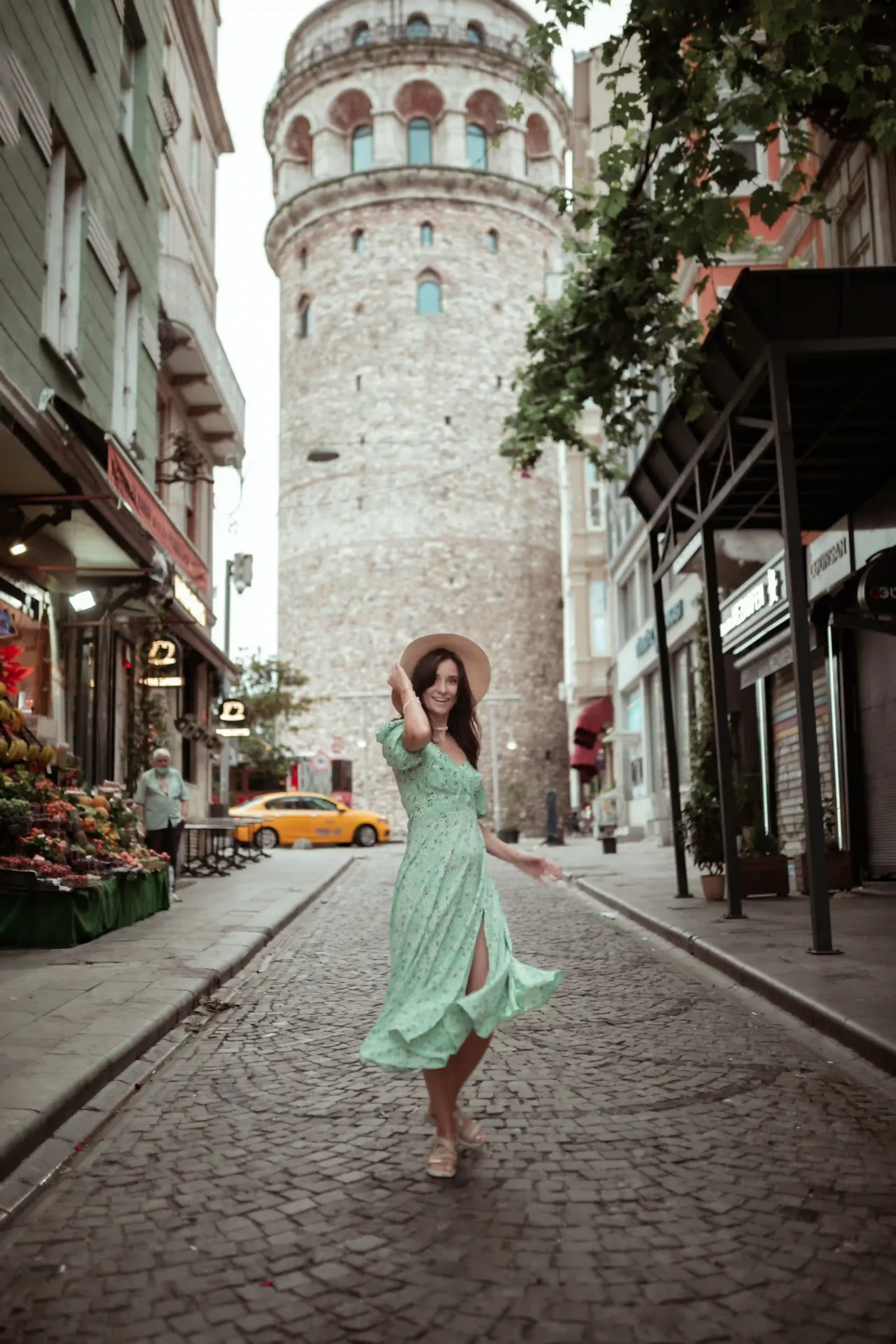 Women enjoying a quit Galata street in a light summer dress